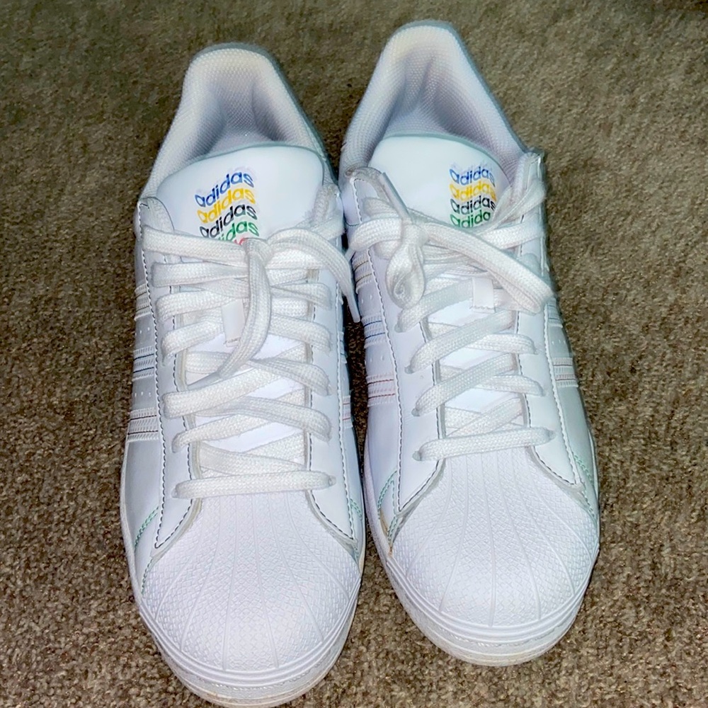 Adidas Superstar with multicolored words and logo